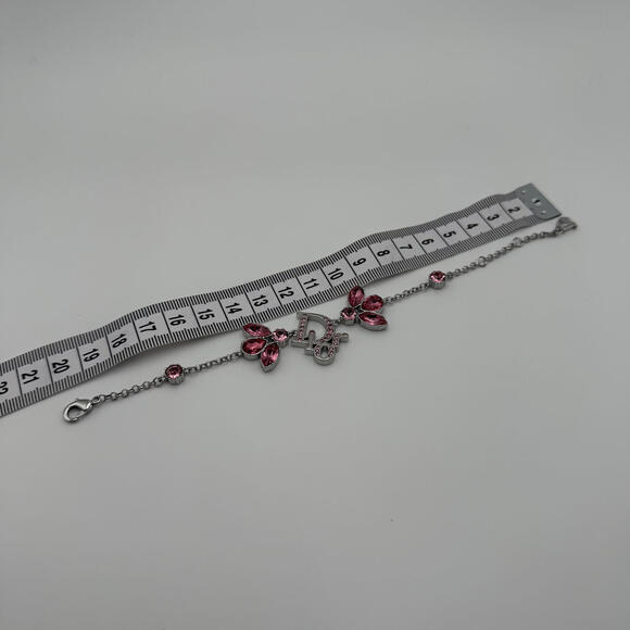 CHRISTIAN DIOR PINK CRYSTAL LOGO BUTTERFLY BRACELET - Picture 6 of 6